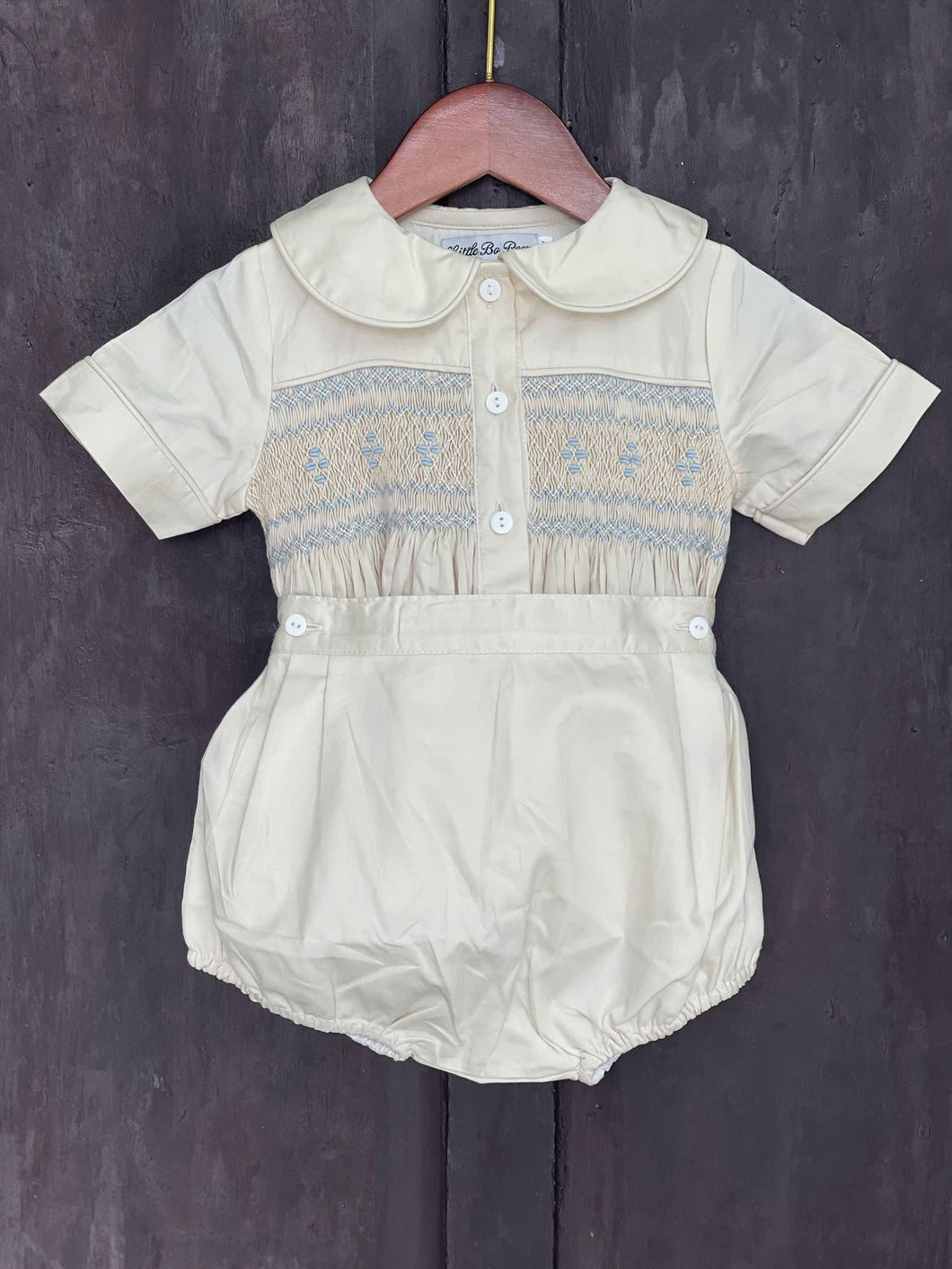 Boys cream with blue smock ( delivery in September