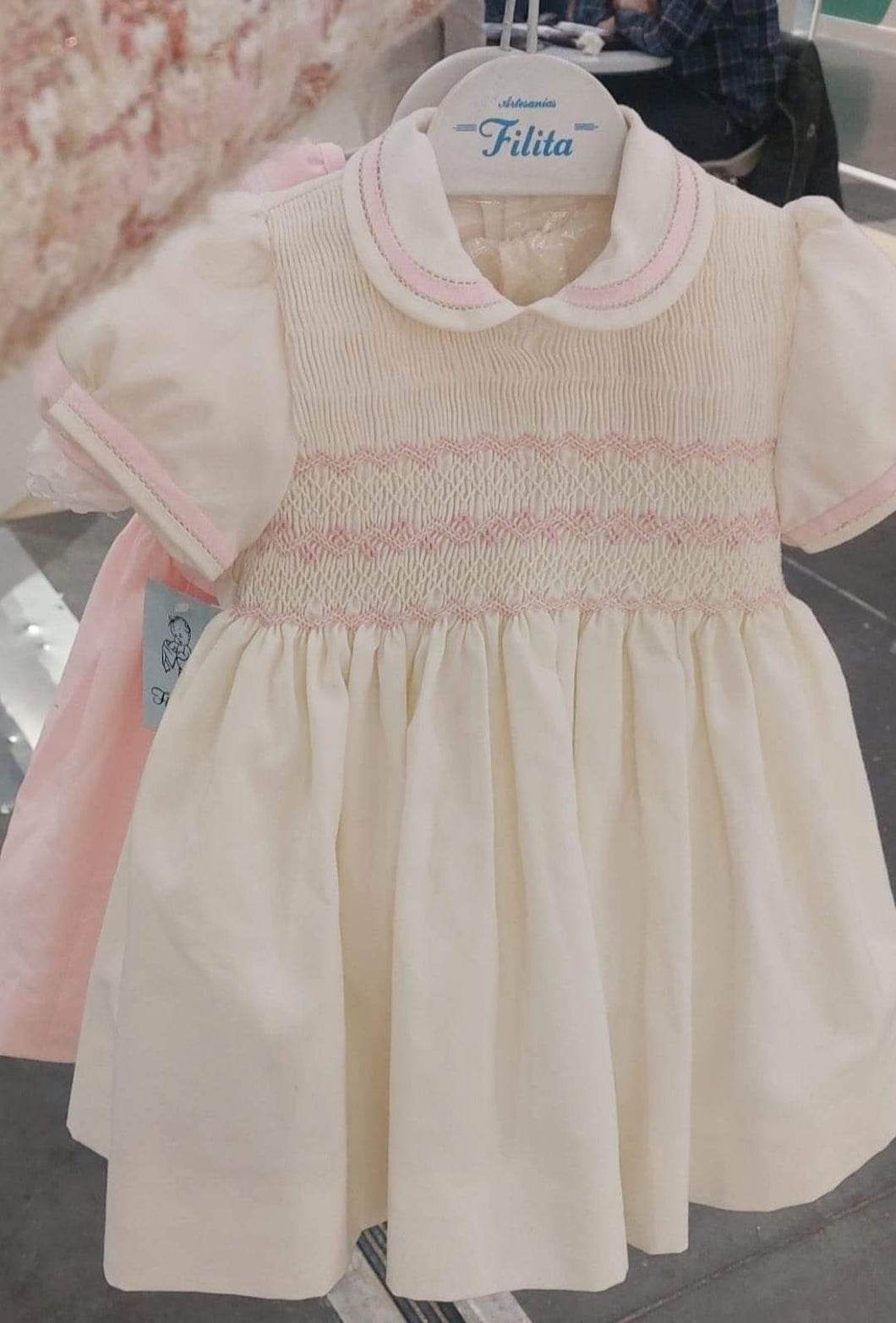 Filita cream with pink smocking