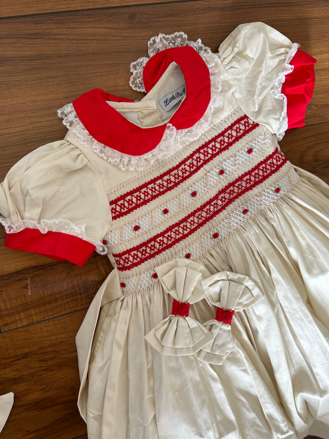 Cream with red smocking (preorder October delivery)