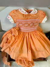 Load image into Gallery viewer, Girls orange dress with pink smocking