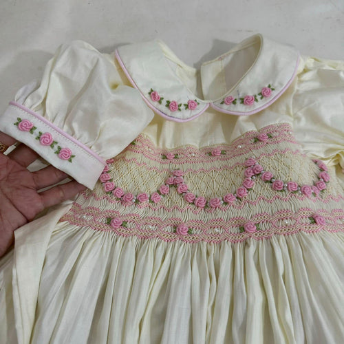 cream with baby pink smocking & pearl detail