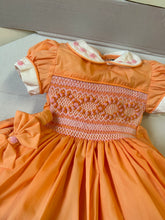 Load image into Gallery viewer, Girls orange dress with pink smocking